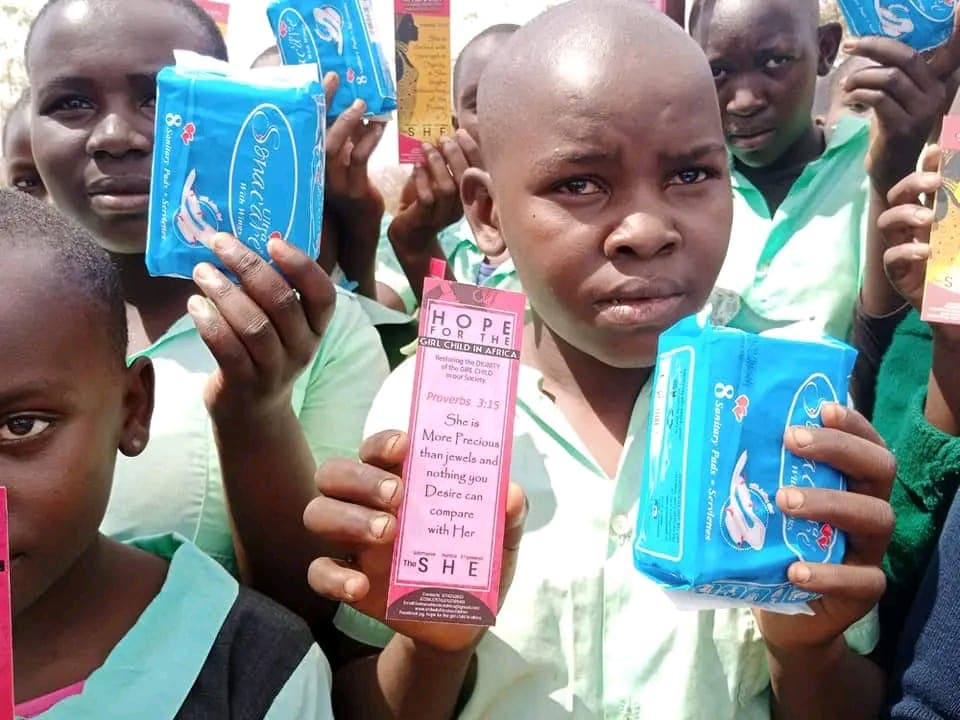 Girls receiving sanitary pad packages